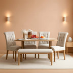 Elegant industrial solid wood dining table set with plush chairs and bench in a stylish dining room.