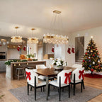 Gold chandelier light for dining room featuring crystal accents and adjustable hanging height.