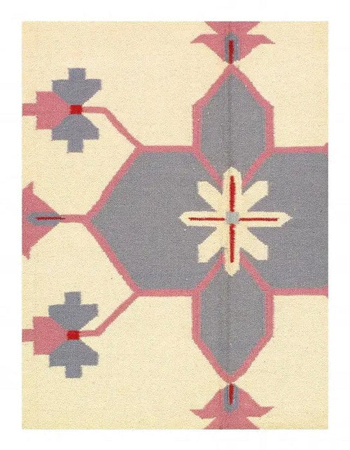  9x12 ivory rug hand woven pure cotton with tribal-inspired pattern for living room or bedroom.