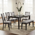 Upholstered dining chairs and cherry brown table set with bench in transitional dining room.